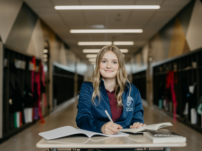 A Student Works from Her Desk at a Catholic Classical Hgh School by Mission by Design