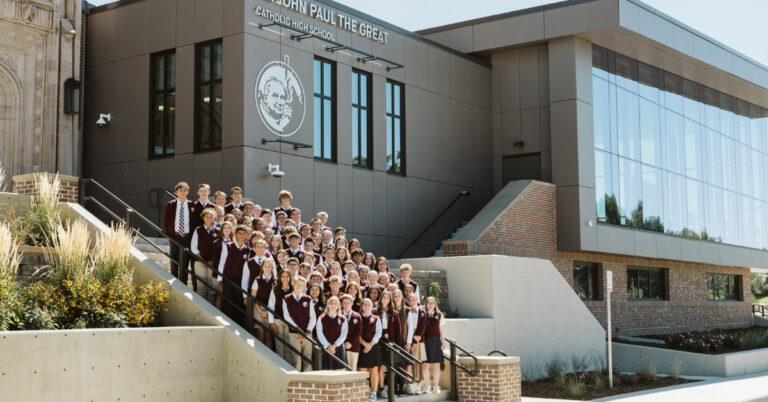 Students on the steps of John Paul the Great High School